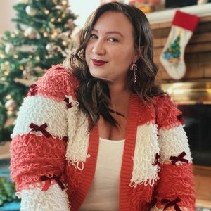 Pink and white striped sweater with red bows